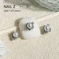 Silver 3D nail art charm featuring a central pearl and zircon accents for manicures, SKU G634# - 7.6x5.6mm (1 Piece/Pack)