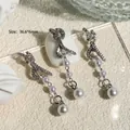 Exquisite silver bow nail jewelry pendants with pearl tassels and shimmering crystal accents - 36.6x6mm (1 Piece/Pack)