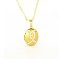 Close-up detail of a vintage gold oval locket necklace with a delicate pearl ribbon inlay - Oval Locket with Beads