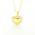 Detailed view of a gold heart-shaped locket necklace featuring a delicate pearl border design - Heart-Shaped Artificial Pearl Style