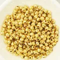 Macro view of textured 18k gold plated faceted spacer beads for DIY jewelry making. - 2.5mm / Gold