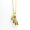 Detailed macro view of a gold-plated teddy bear pendant encrusted with clear and black zircons - Black and White Bear