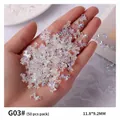 Iridescent aurora bow-knot nail art charms held in hand, 50-piece pack, 11.8x9.2mm size - Aurora Iridescent Bow (G03#) / 50 Pieces/Pack (11.8*9.2mm)