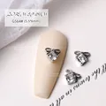 Elegant silver bow-shaped nail art charm featuring a sparkling clear zircon heart center - Bowknot Style (G564#)