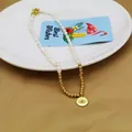 Vista detallada de un collar de perlas y cuentas doradas con un colgante del ojo turco - Estilo Moneda Mal de Ojo Color Mixto (2#)