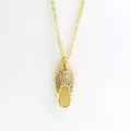 Close-up of golden slipper pendant necklace encrusted with shimmering white zircons - Full Rhinestone Flip Flop Style (aa7)