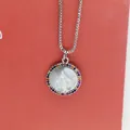 Close-up view of a Virgin Mary circular shell necklace featuring a colorful zircon border - Virgin Mary Portrait Rainbow Zirconia (a1) / Silver