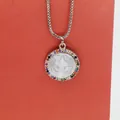 Macro detail of round shell pendant with colorful cubic zirconia border and silver chain - Saint Benedict Colorful Zirconia (a3) / Silver
