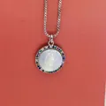 Macro shot of Virgin Mary carved shell pendant with colorful zircons and silver box chain. - Virgin Mary Relief Colorful Zirconia (a4) / Silver