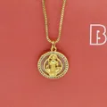 Macro view of gold round shell Maria pendant necklace with white zirconia pave detail - Round Icon White Zirconia (a9)