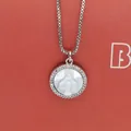 Detailed close-up view of the circular Virgin Mary shell pendant with zircon stone halo - Virgin Mary White Zirconia (a8)
