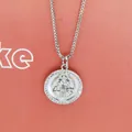 Close-up of a silver Virgin Mary pendant necklace featuring shell inlay and zircons - Madonna Portrait White Zirconia (a6)