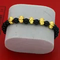 Detailed view of the 2025 Zodiac Snake bracelet with black obsidian and gold charms. - Obsidian Five Blessings Snake Style (B2)