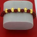 Detailed view of 2025 Year of the Snake bracelet featuring red agate and gold charms. - Dark Red Agate Five Blessings Snake Style (B3)