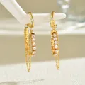 Elegante 18K vergulde gedraaide oorringen met hangende kettingen en glimmende stenen - Kwastje Ketting Oormanchet (Rechts)