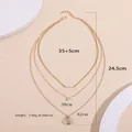 Elegant triple-layered gold-plated necklace featuring pearls and circular disc pendants - Alloy Layered Necklace (XL090)