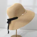 Elegant wide-brim straw sun hat with pearl flower band and black lace bow for beach vacation - M (55-57.5) / Natural Straw with Black Ribbon