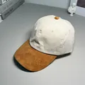 Close-up of a two-tone corduroy baseball cap with beige crown and brown brim. - M (56-58cm) / Light Brown and Beige Colorblock