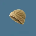 Close-up detail showing the ribbed knit texture of a khaki melon skin beanie hat - Elastic Adjustable / Yellow