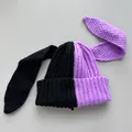 Detail view of a black and purple contrast color knitted beanie with long bunny ears - M (56-59cm) / Black & Purple Patchwork