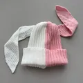 Close-up of a two-tone pink and white knitted beanie with adorable long bunny ears - M (56-59cm) / White and Pink