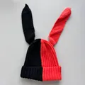 Detailed view of a red and black split-color knitted beanie featuring long rabbit ears - M (56-59cm) / Black Red Patchwork