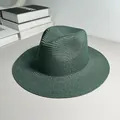 Detail shot of a dark green Panama straw hat with a fine woven texture and classic fedora crown. - One Size Adjustable / Plain / Dark Green