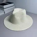 Close-up of a classic cream-white woven Panama straw hat for beach sun protection. - One Size Adjustable / Plain / Milky White