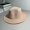 Detailed macro shot showing the fine texture of a woven Panama straw jazz fedora hat - One Size Adjustable / Plain / Light Pink