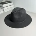 Detailed view of a classic black woven Panama hat for sun protection and summer beach style - One Size Adjustable / Plain / Black