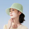 Stylish light green wide brim bucket hat with checkered lining worn by a model - 55-60cm / Pine Green