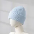 Detail view of light blue knitted rabbit fur beanie showing the soft thick ribbed texture - Azure Blue