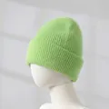 Neon green rabbit fur knit beanie shown on a white mannequin head close-up detail - Grass Green