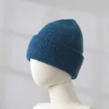 Detailed view of soft blue rabbit hair knitted beanie showing the thick fuzzy texture - Peacock Blue