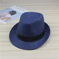 Close-up detail of a navy blue woven straw fedora hat featuring a black ribbon band - Navy Blue (Satin Ribbon)