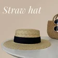Elegant beige flat top straw hat with a black ribbon band for summer beach sun protection - One Size / Beige with Black Ribbon