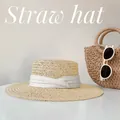 Elegant flat top straw hat with white ribbon and summer beach props. - One Size / Beige with White Ribbon