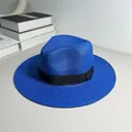 Close-up of a blue woven Panama straw hat with a black ribbon band. - One Size Adjustable / Ribbon Style (Detachable) / Sapphire Blue