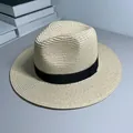 Close-up of a classic Panama straw hat with a stylish black ribbon on gray surface - One Size Adjustable / Ribbon Style (Detachable) / Beige