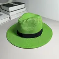 Close-up detail of a vibrant green woven Panama straw hat featuring a black ribbon band - One Size Adjustable / Ribbon Style (Detachable Ribbon) / Grass Green