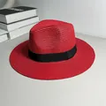 Close-up of red Panama straw hat with a classic black ribbon band and woven texture - One Size Adjustable / Ribbon Style (Detachable Ribbon) / Red