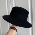 Close-up of a black wool felt flat-top hat with a smooth brim for women - 56-58cm Adjustable / Black