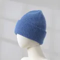 Close-up of blue rabbit hair knitted beanie showing soft texture and ribbed cuff detail. - Light Blue