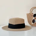 Elegant flat-top straw sun hat with a black ribbon band for beach vacations. - One Size / Black Satin Ribbon