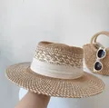 Elegant hand-woven straw sun hat for women featuring a flat top and stylish white ribbon trim - One Size / Wavy Weave Style