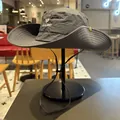Side view of gray outdoor sun hat with TICALBIRD embroidery on a black display stand - M (56-58cm) / Grey Blue