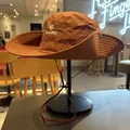 Detail view of a brown outdoor sun hat with embroidered logo for hiking and camping. - M (56-58cm) / Orange Red