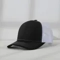 Detail of a black and white mesh trucker hat showing the contrast stitching on the brim - Adjustable (56-58cm) / Black with White Mesh