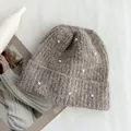 Close-up of a stylish brown knitted beanie hat with elegant pearl decorations for winter. - Hat Circumference (53-60cm) Elastic / Mocha