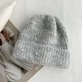 Detailed close-up view of a grey knitted winter beanie with elegant pearl decorations - Hat Circumference (53-60cm) Elastic / Light Gray